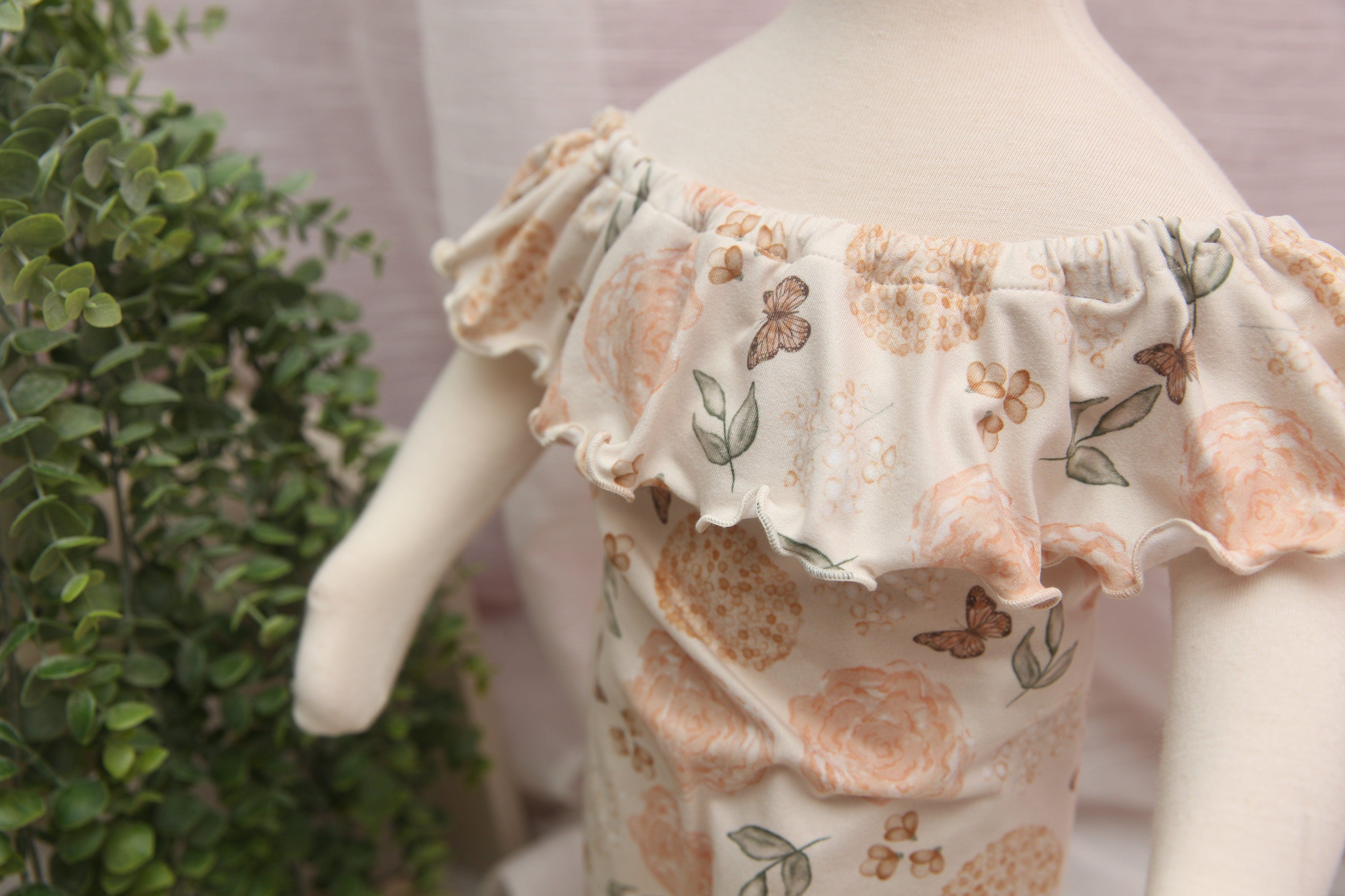 Anisa-Sitter Flutter Romper; Sitter Romper; Peachy Butterfly Floral; READY TO SHIP